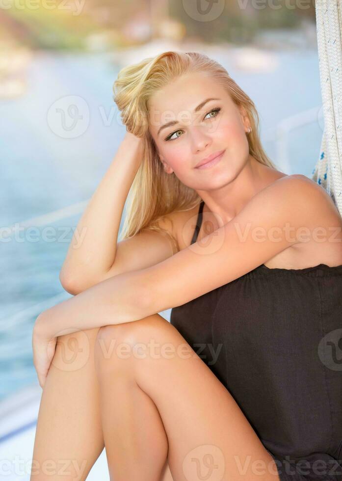 Gorgeous female on sailboat photo