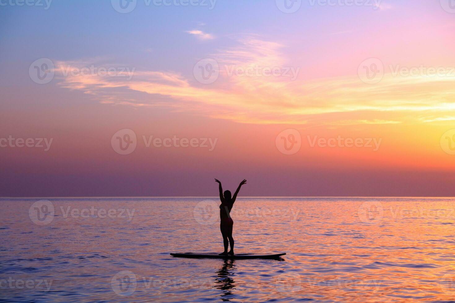 Doing yoga asanas on the beach photo