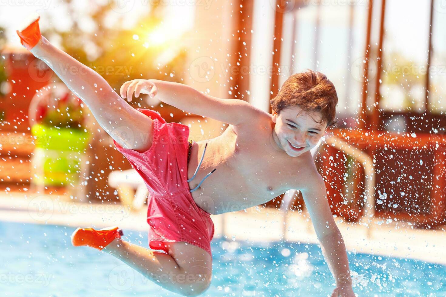 Happy boy in the pool photo