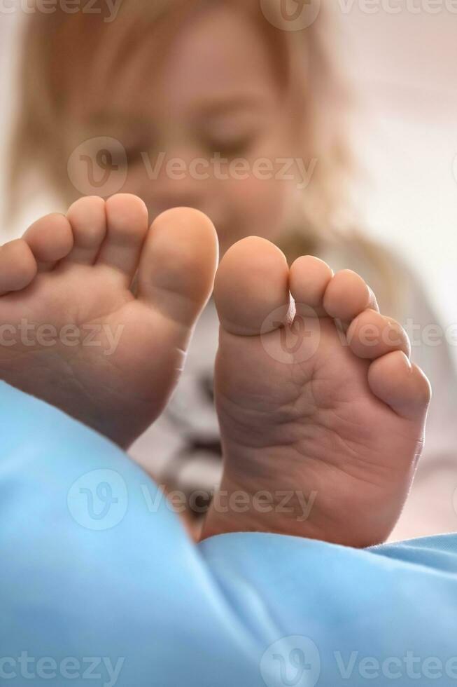 Focus on tiny baby feet photo