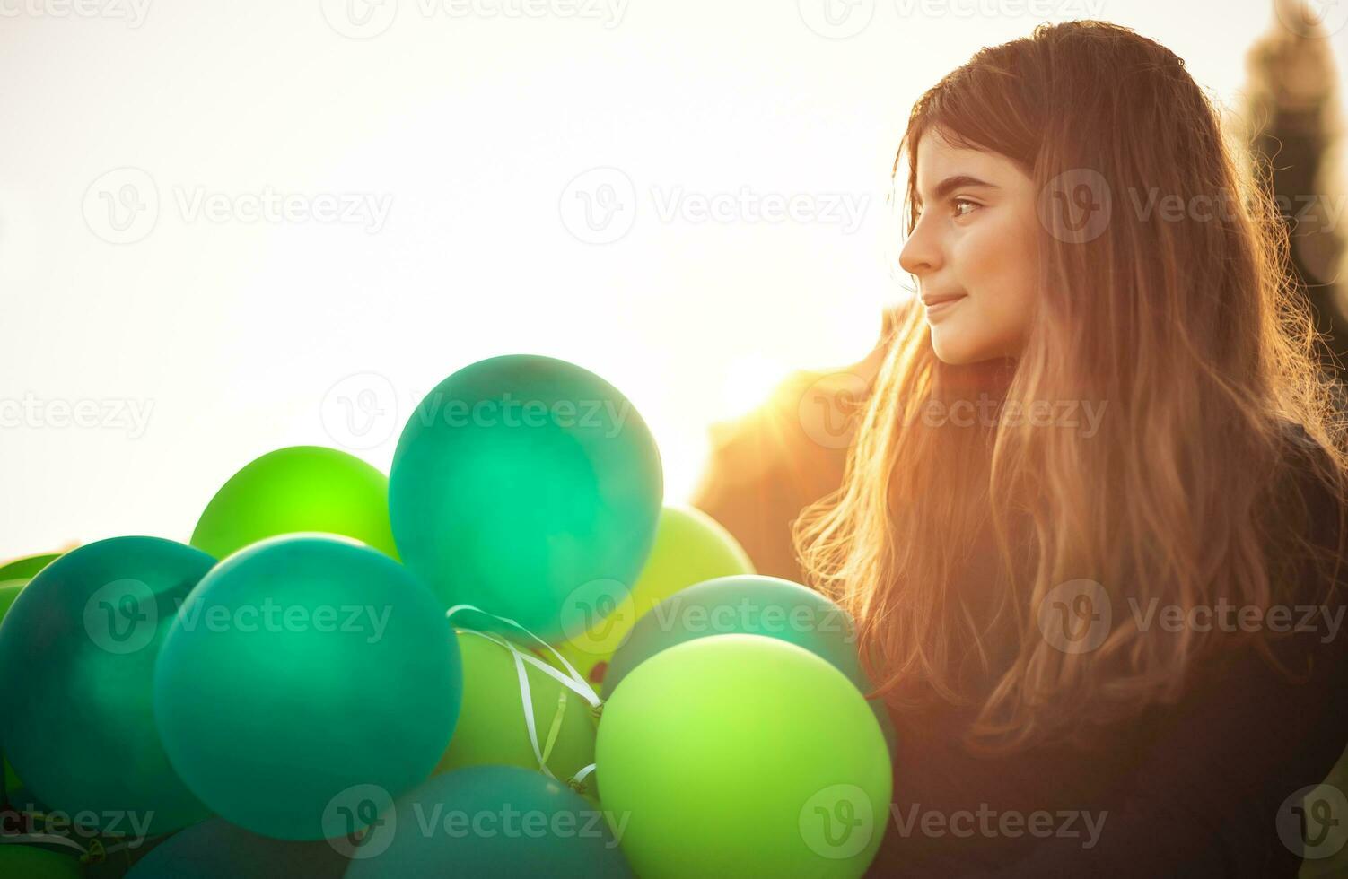 Cute girl with air balloons photo