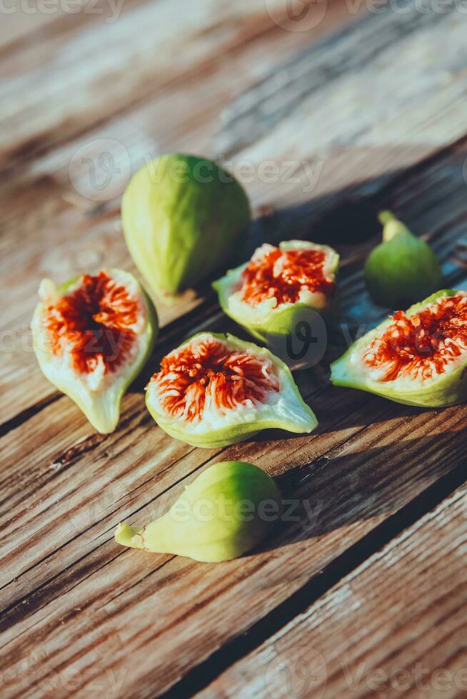 Delicious juicy ripe figs on the table photo