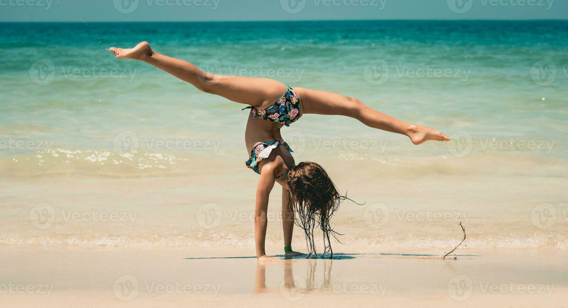 Little Girl Athlete on the Beach photo