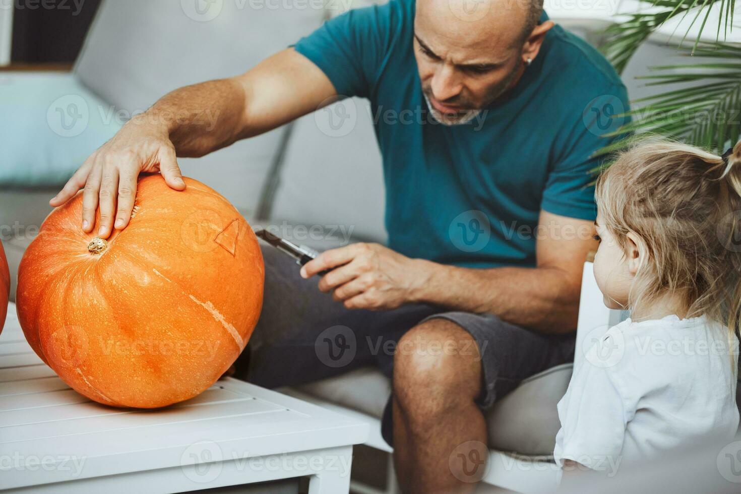 Happy family preparing for Halloween holiday photo