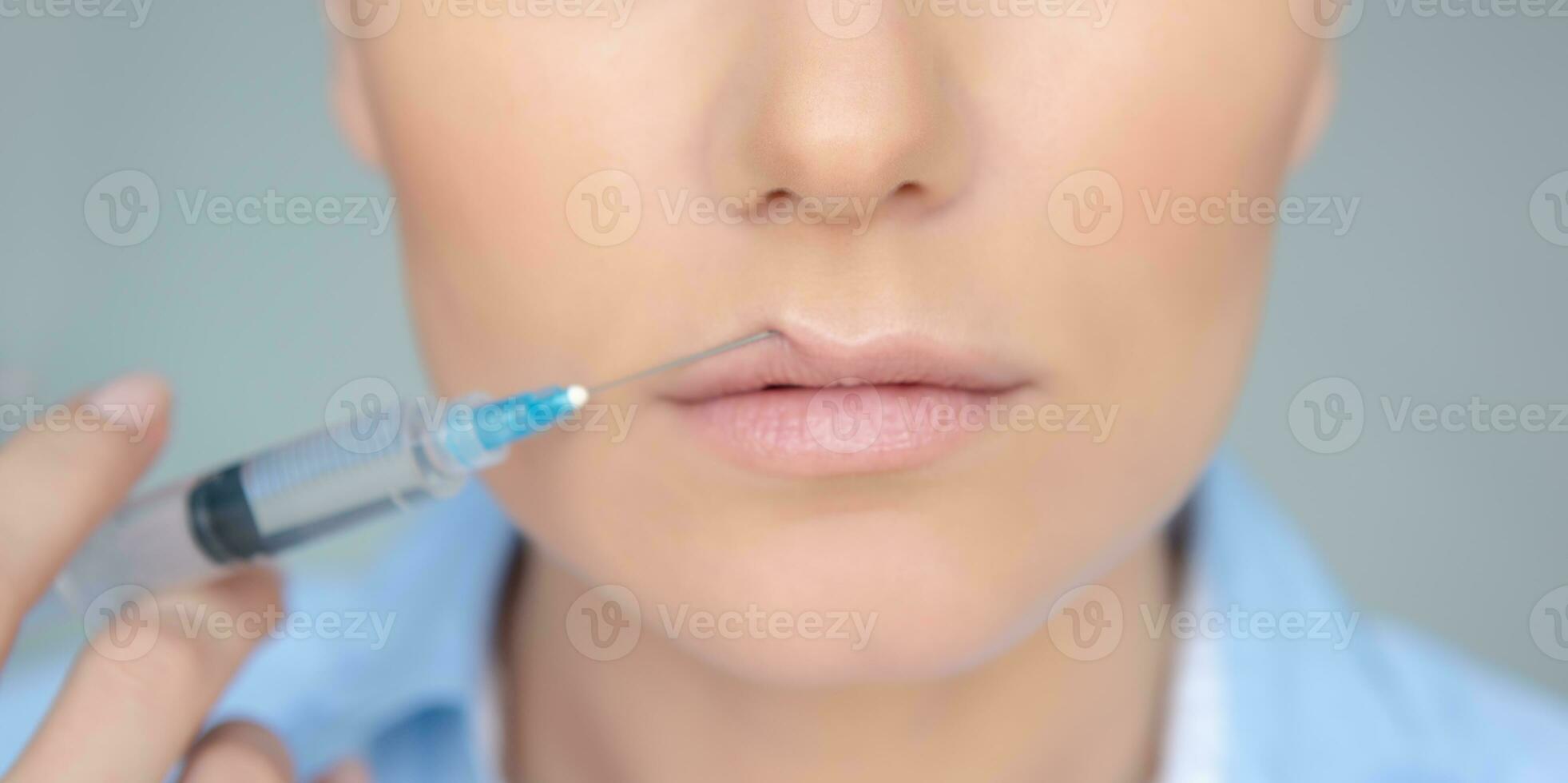 Woman Making a Lip Augmentation photo
