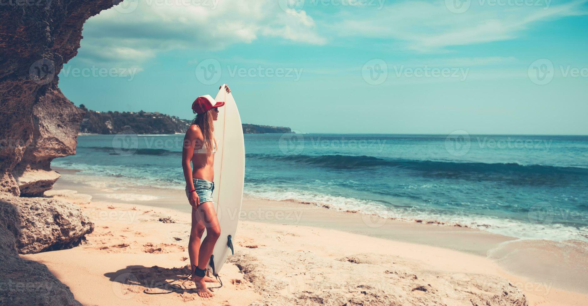 Sportive woman with surfboard photo