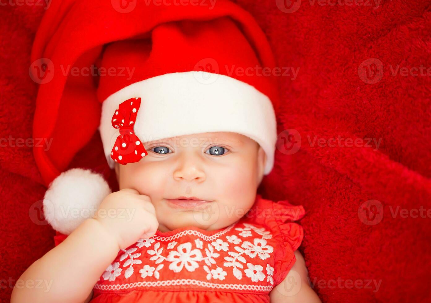 Newborn girl wear Santa hat photo