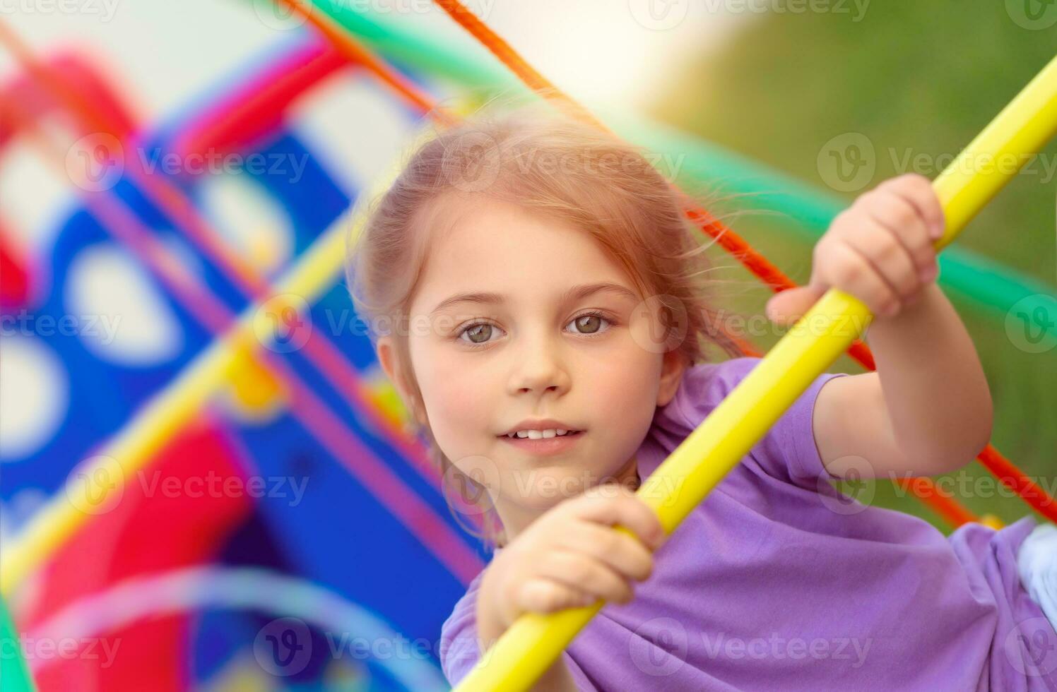 Little girl on playgarden photo