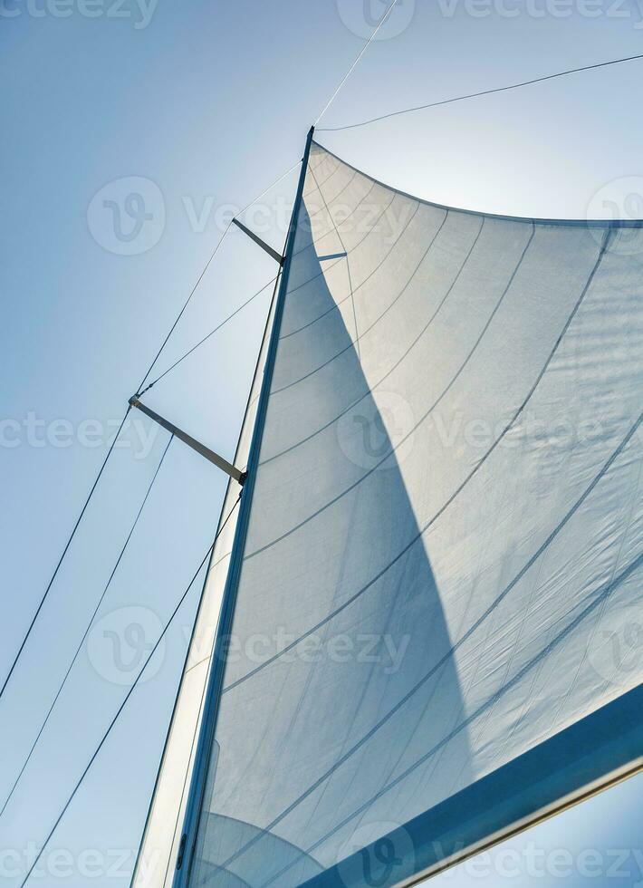 Sail on sky background photo