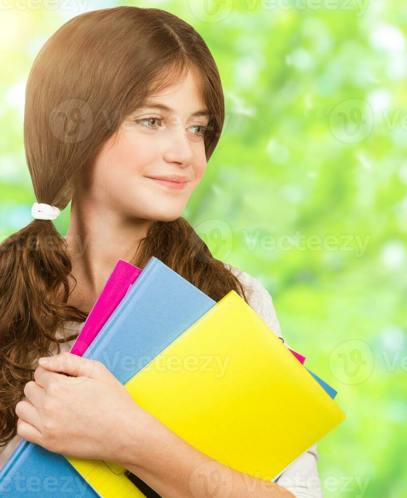 Schoolgirl portrait with books photo