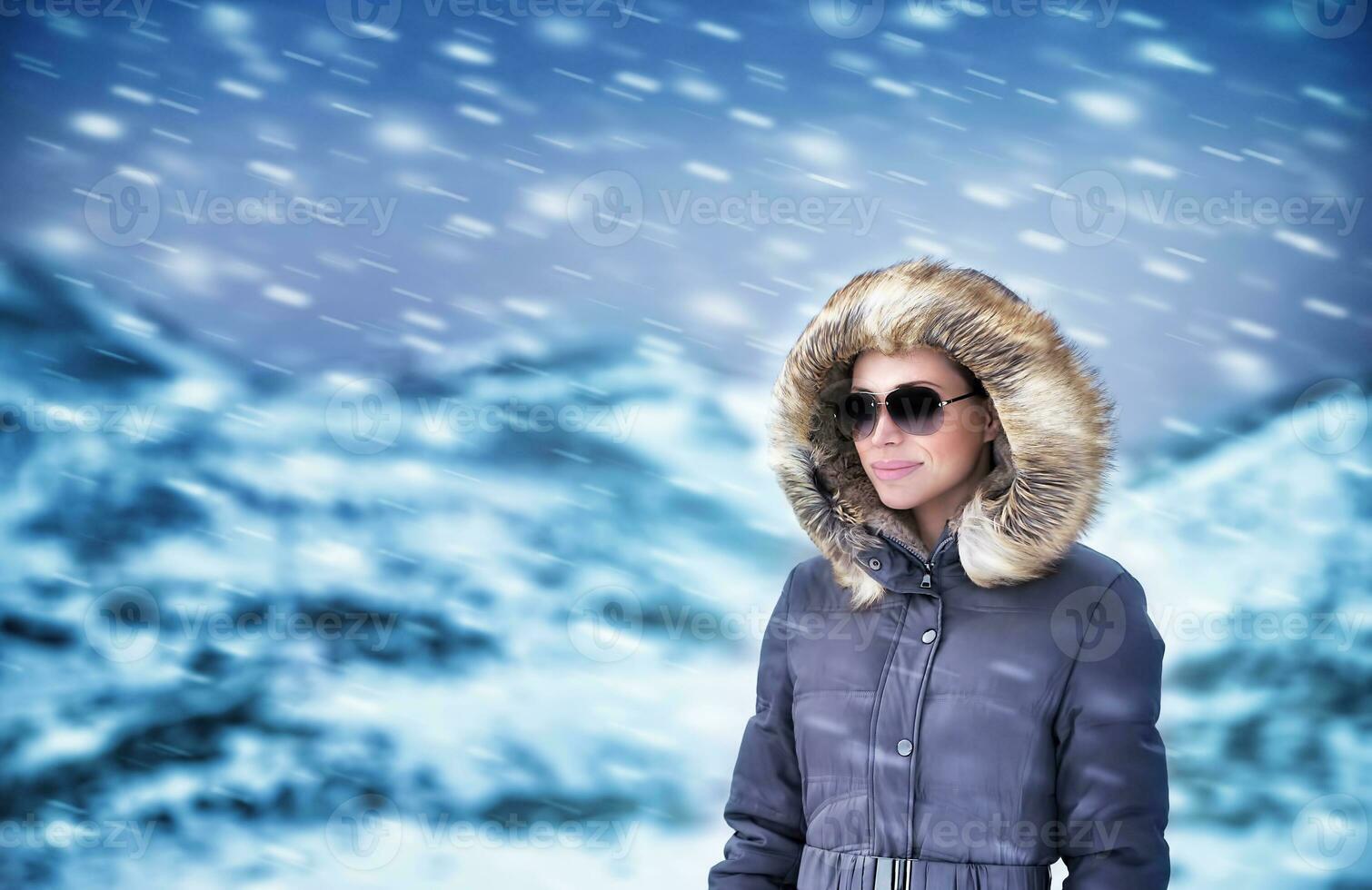 Fashion model in winter mountains photo