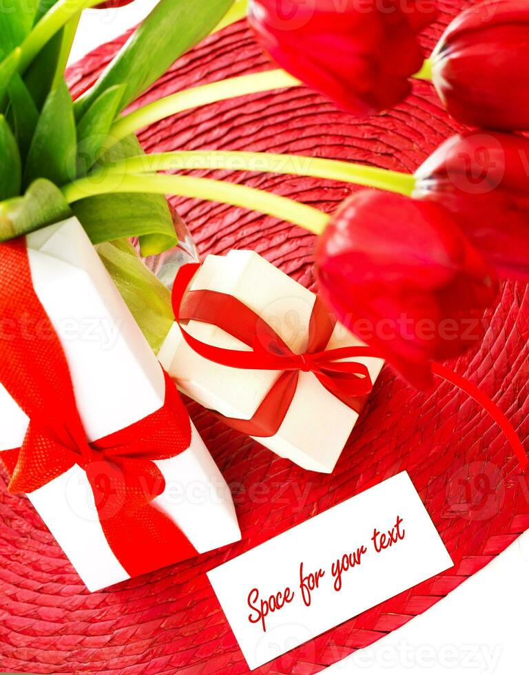 Red tulips and two gift box photo