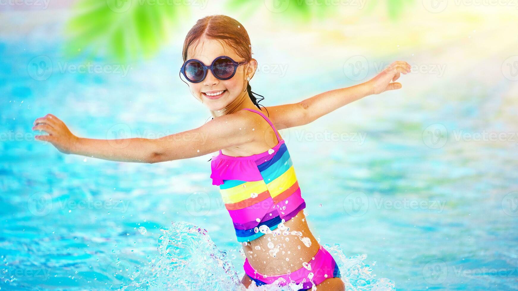 Girl playing in the pool photo
