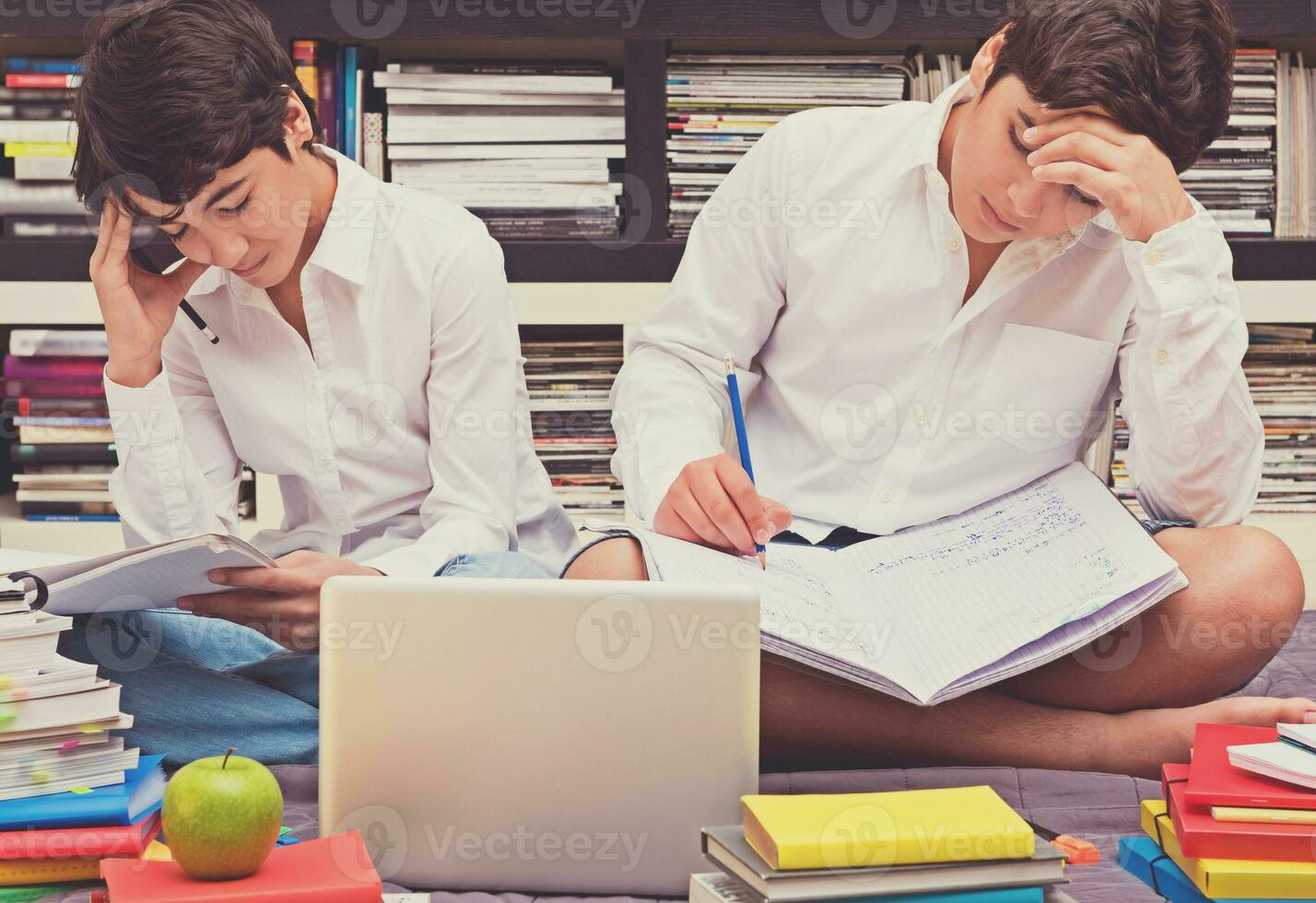 Two schoolboys in the library photo