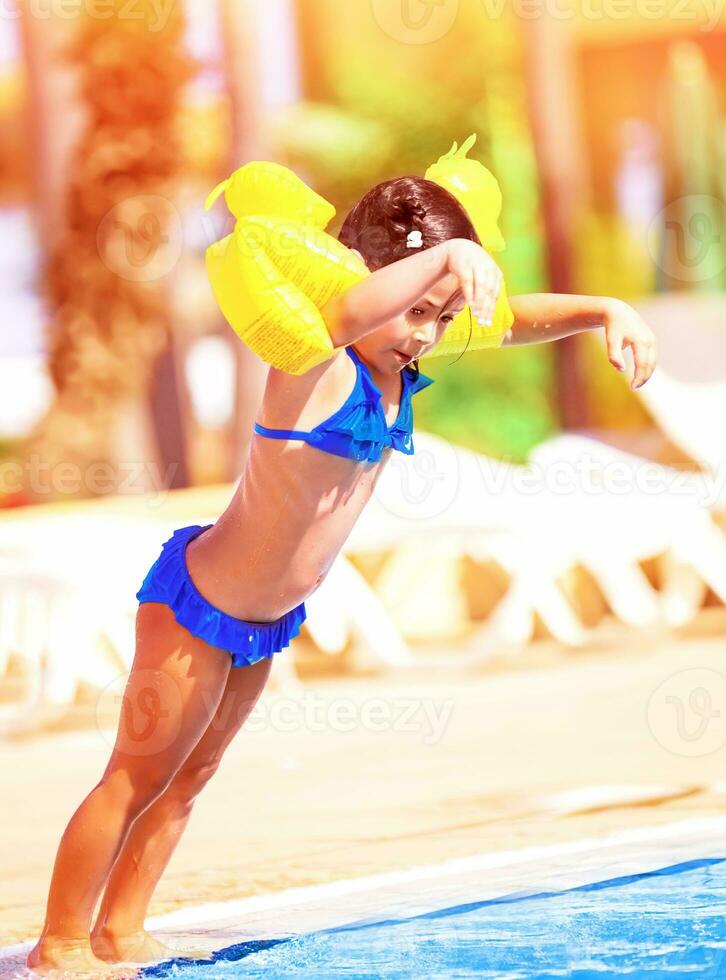 Little girl in the pool photo