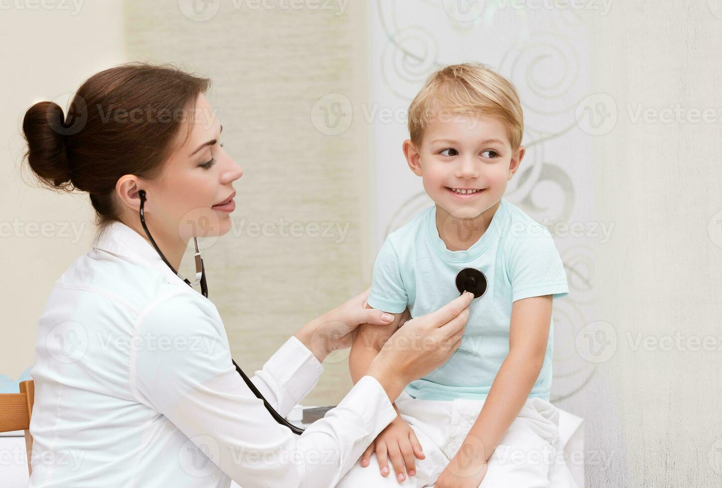 Happy boy at the doctor photo