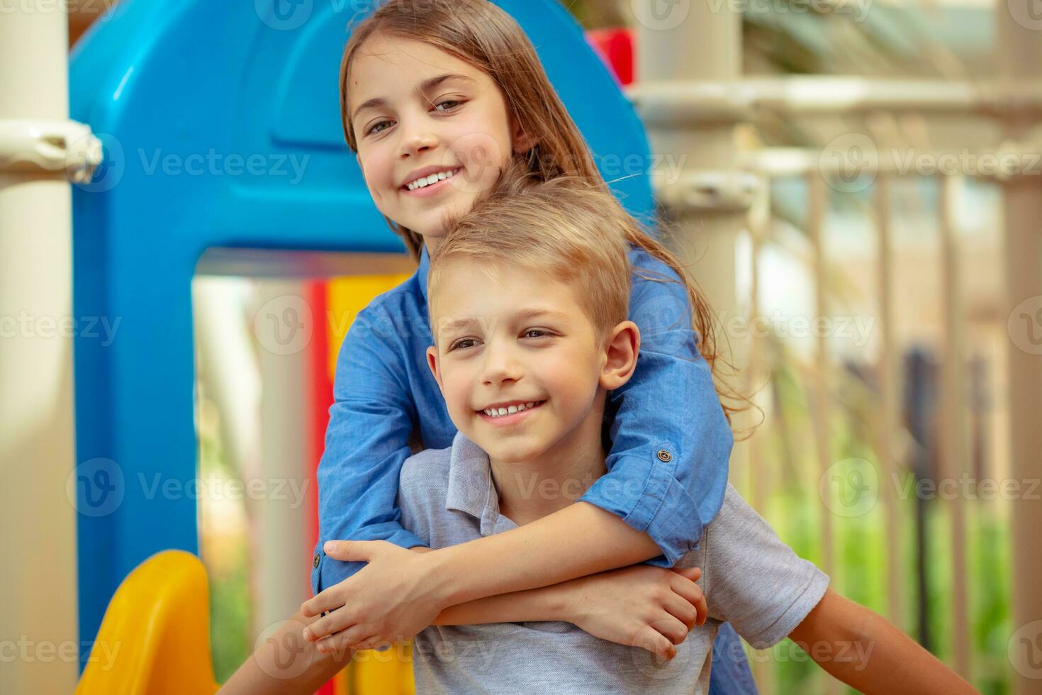 Happy siblings outdoors photo