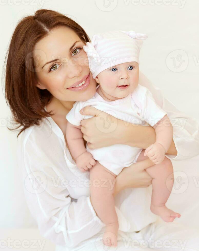 Beautiful woman with newborn daughter photo