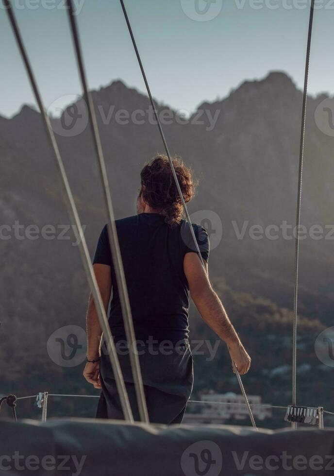 Man Traveling on Sailboat photo