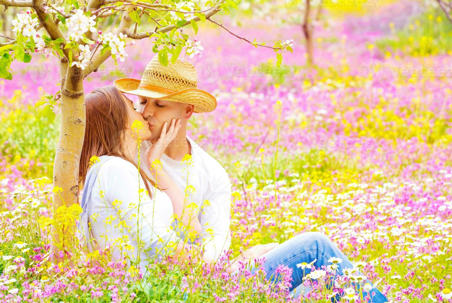 Happy couple kissing outdoors photo