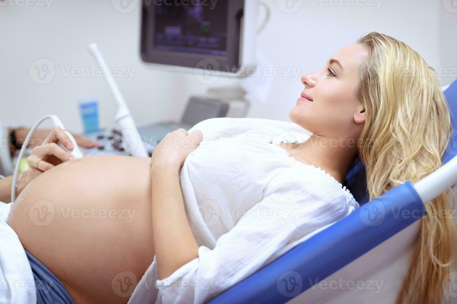 Pregnant woman on ultrasound photo