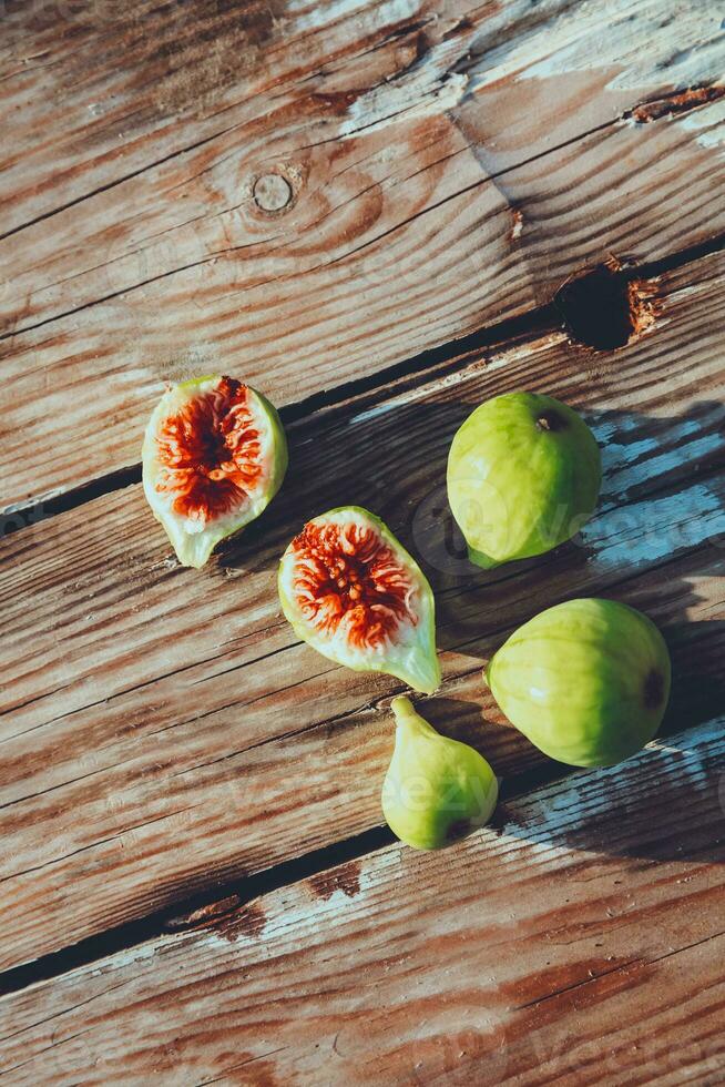 Tasty fresh ripe figs on the table photo