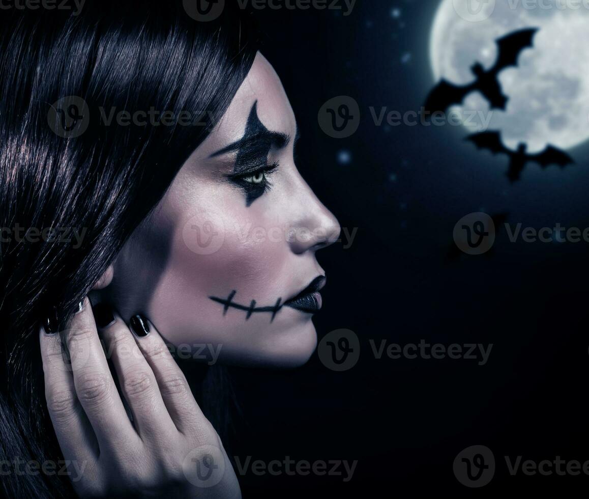 Terrifying witch in Halloween night photo