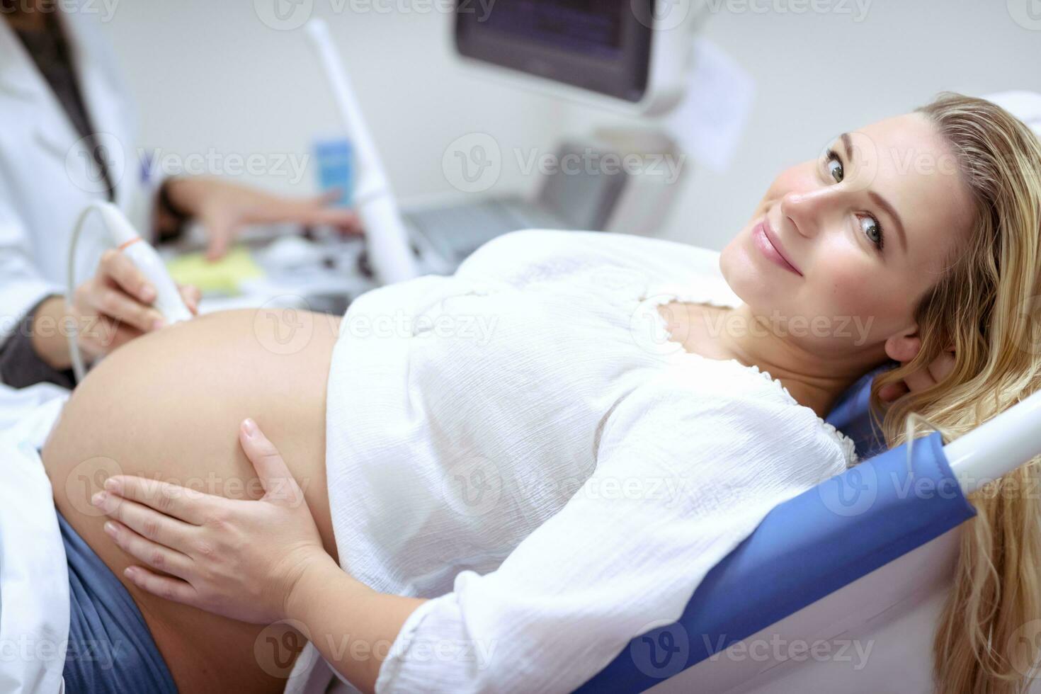 Pregnant female on the ultrasound scan photo