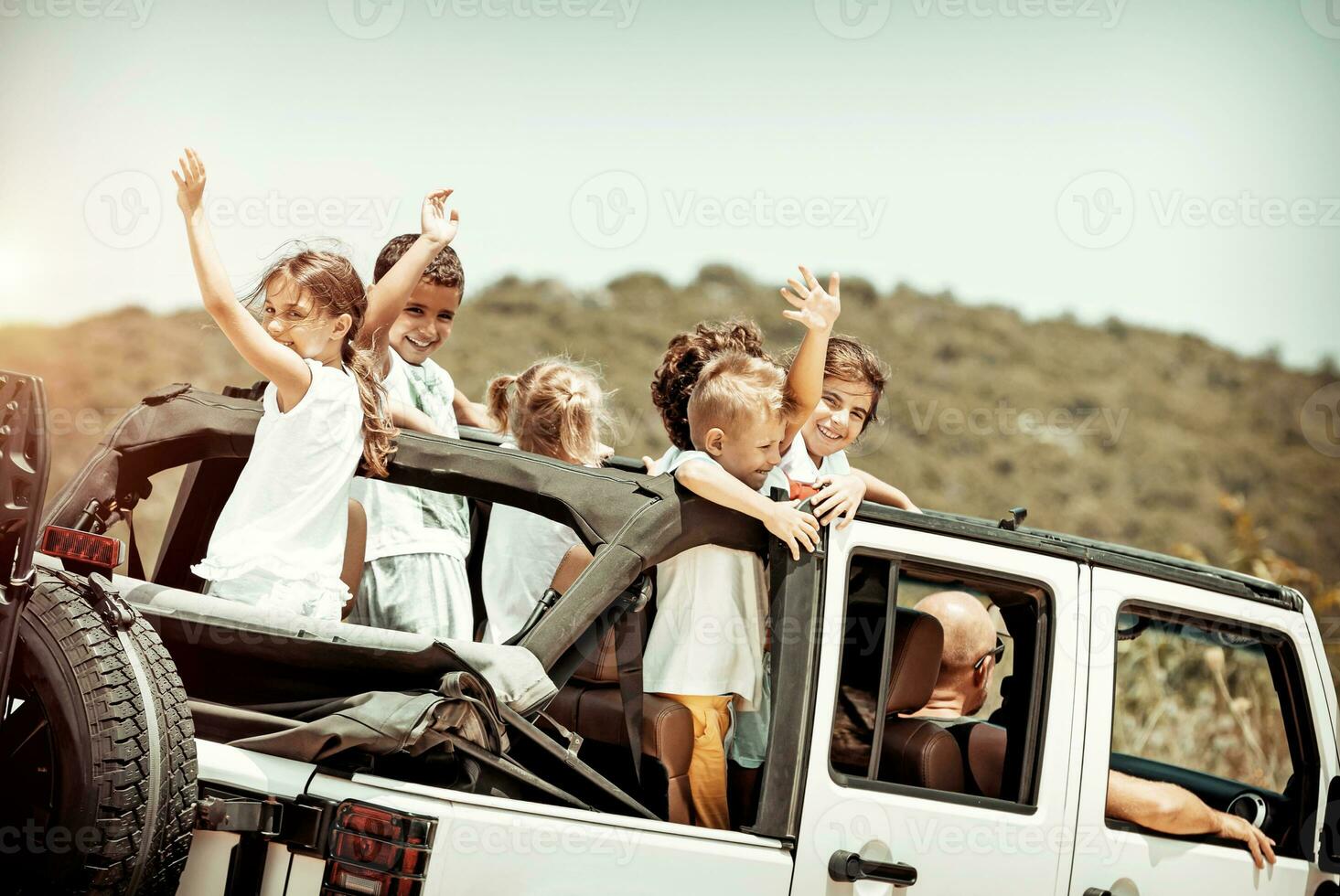 Happy kids enjoying road trip photo
