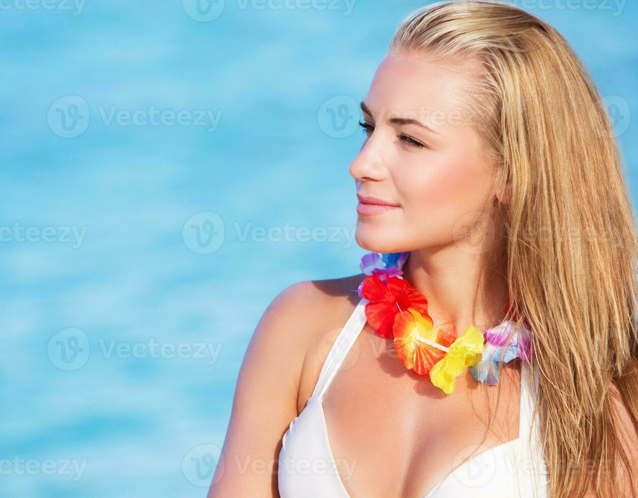 Cute female in Hawaiian leis photo