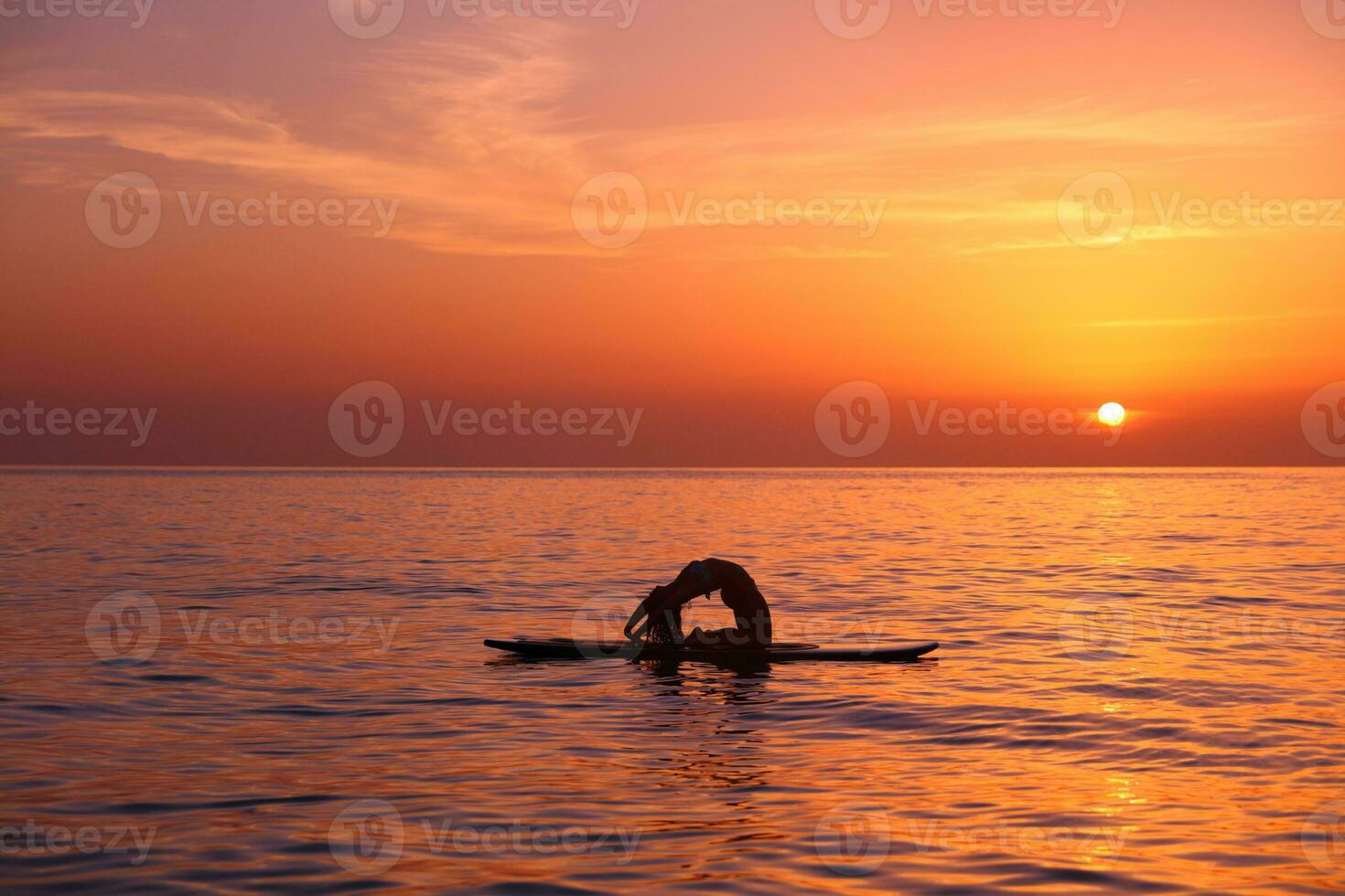Woman trainings on the beach photo