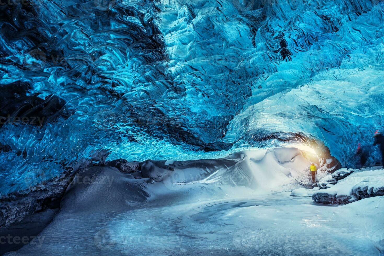 Man in the glacier cave, Iceland photo