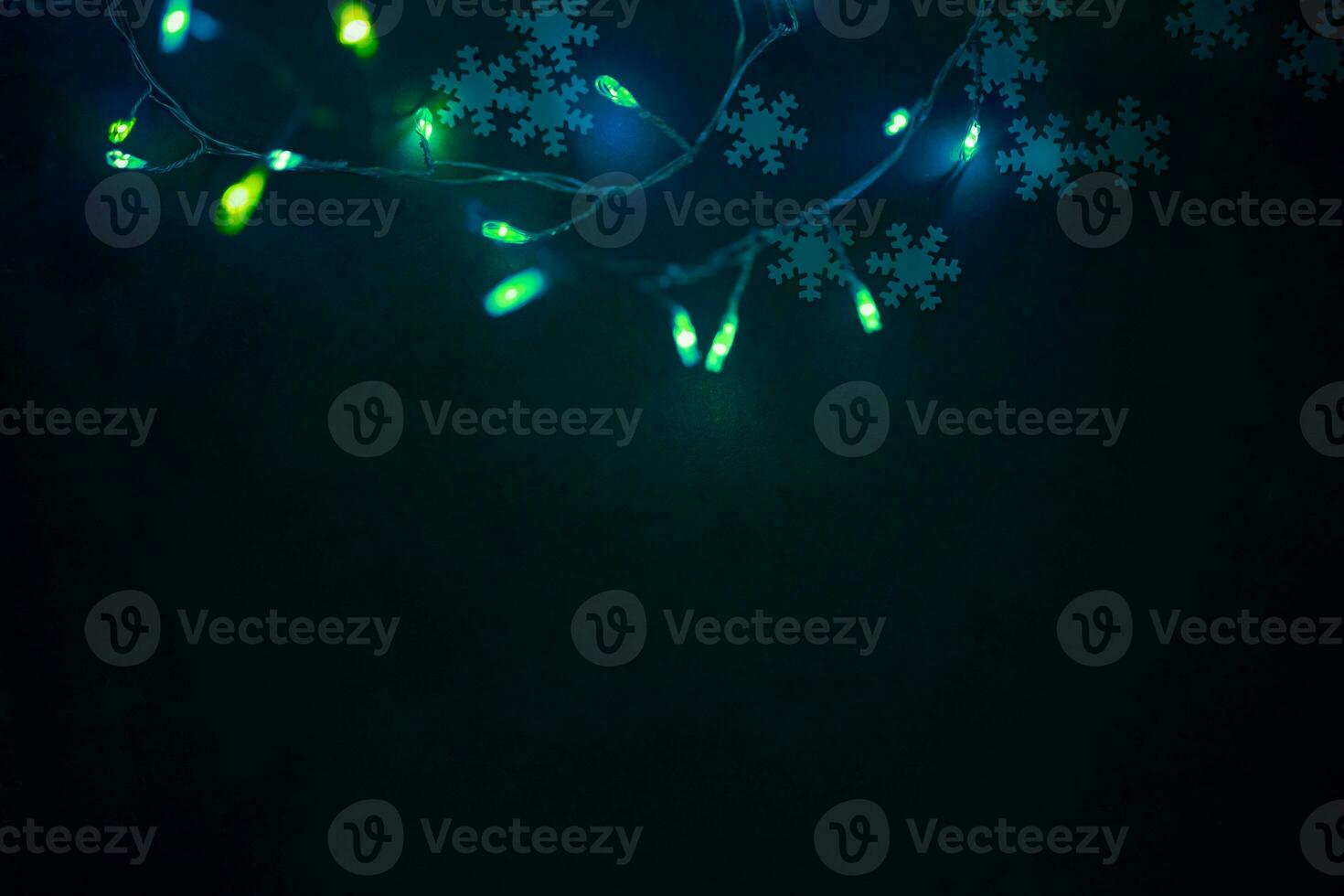 Dark Christmas Background with Green Lights Border photo