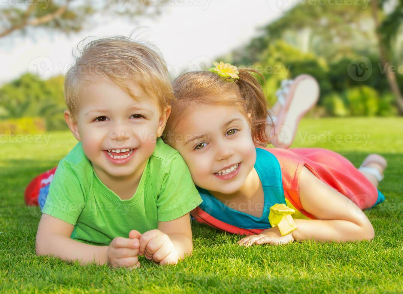 Brother and sister in the park photo