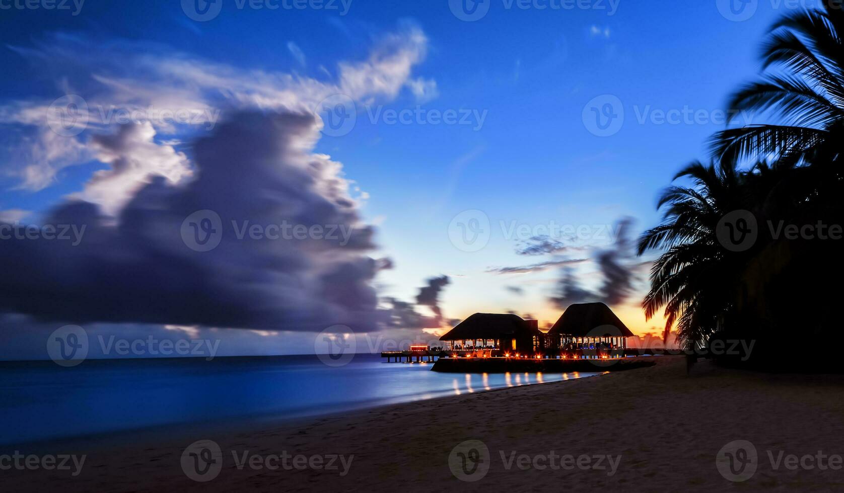 Tranquil night over beach resort photo