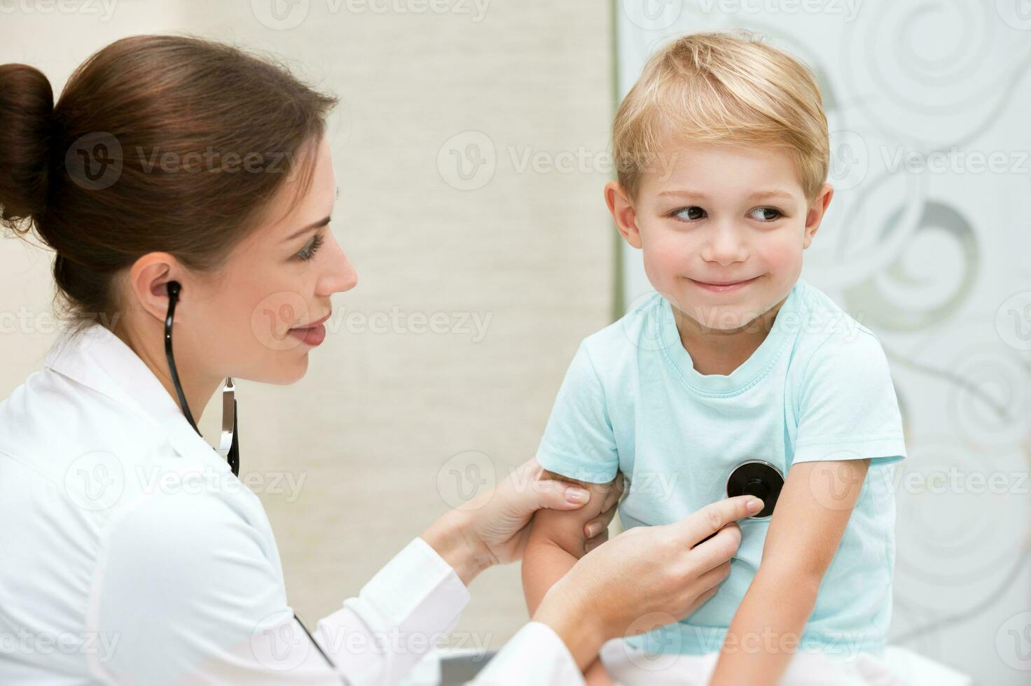 Happy boy at the doctor photo