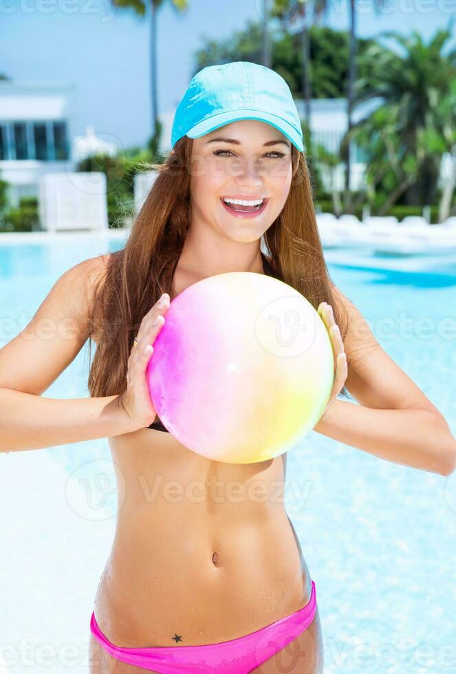 Happy woman playing with ball photo