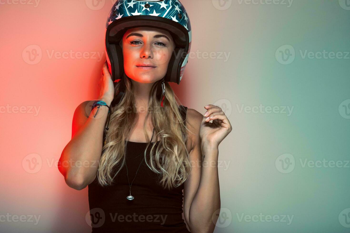 Stylish fashionable biker girl in helmet photo