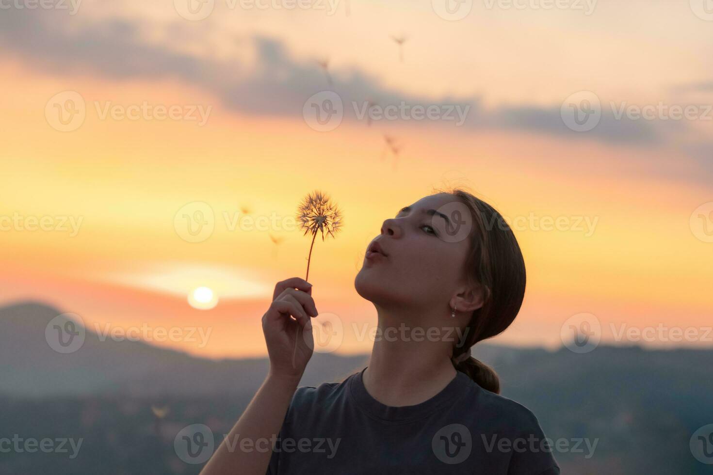 Nice teen girl making a wish photo
