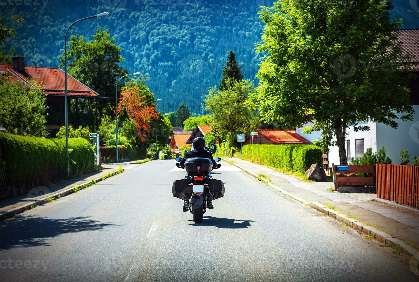 Motorcyclist touring along Austria photo