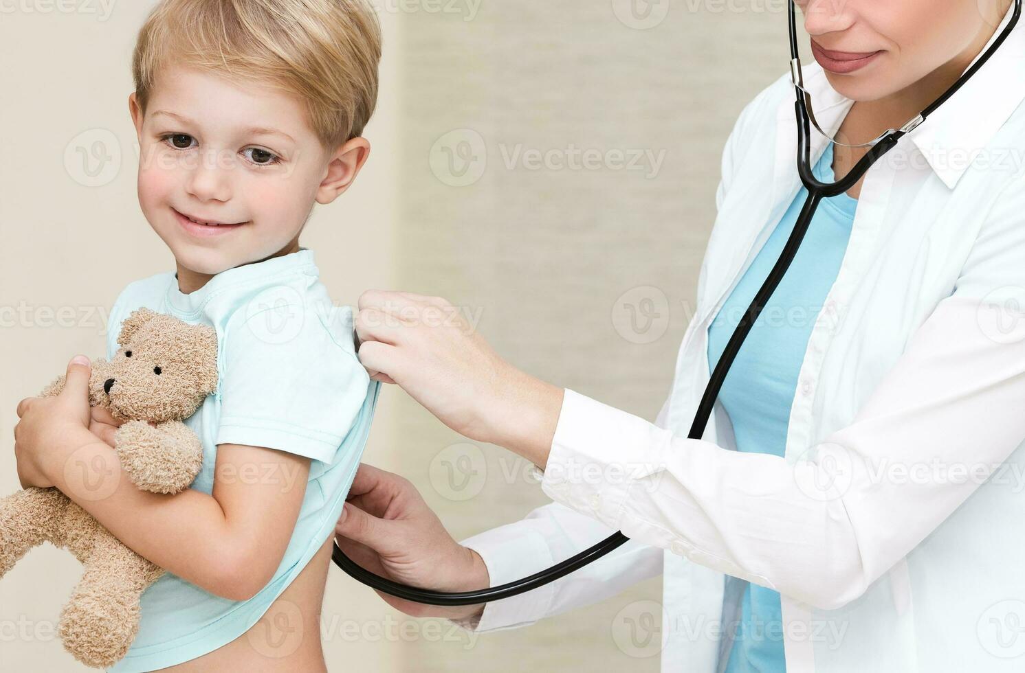 Happy boy visiting doctor photo