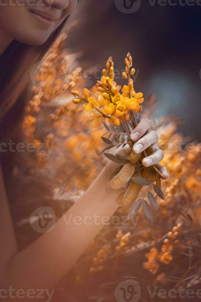 Dreamy girl on flowers field photo