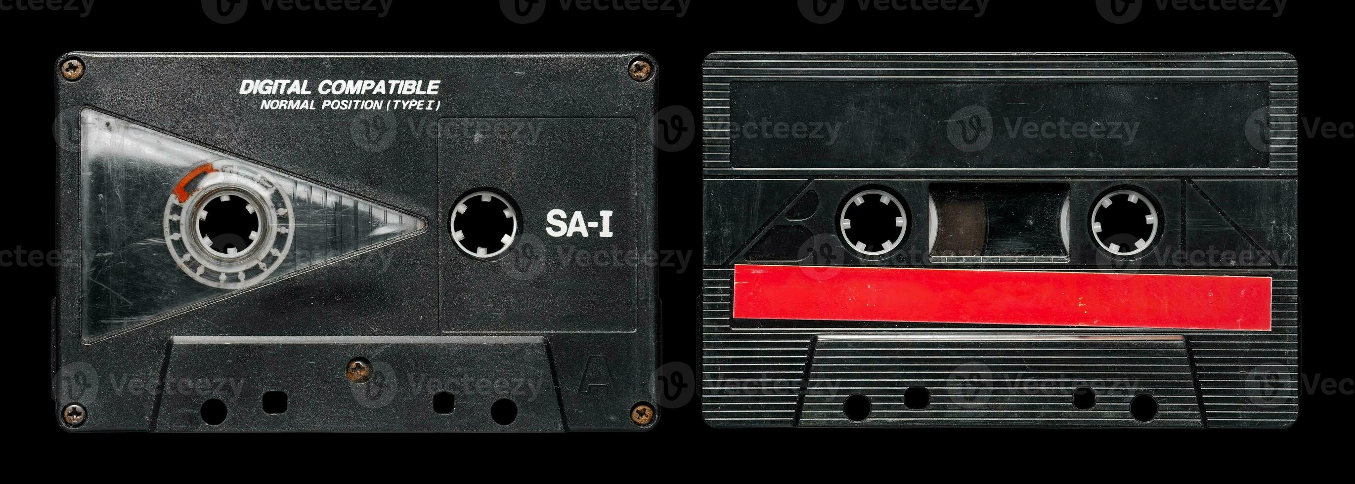 Old audio cassette tape collection with blank label. black and red photo