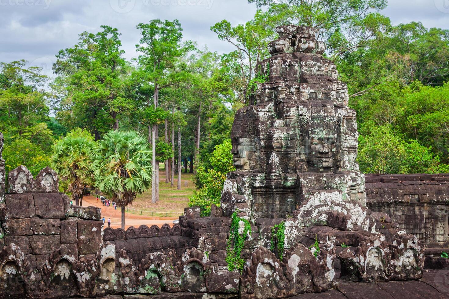 Ancient stone faces of Bayon temple, Angkor, Cambodia photo