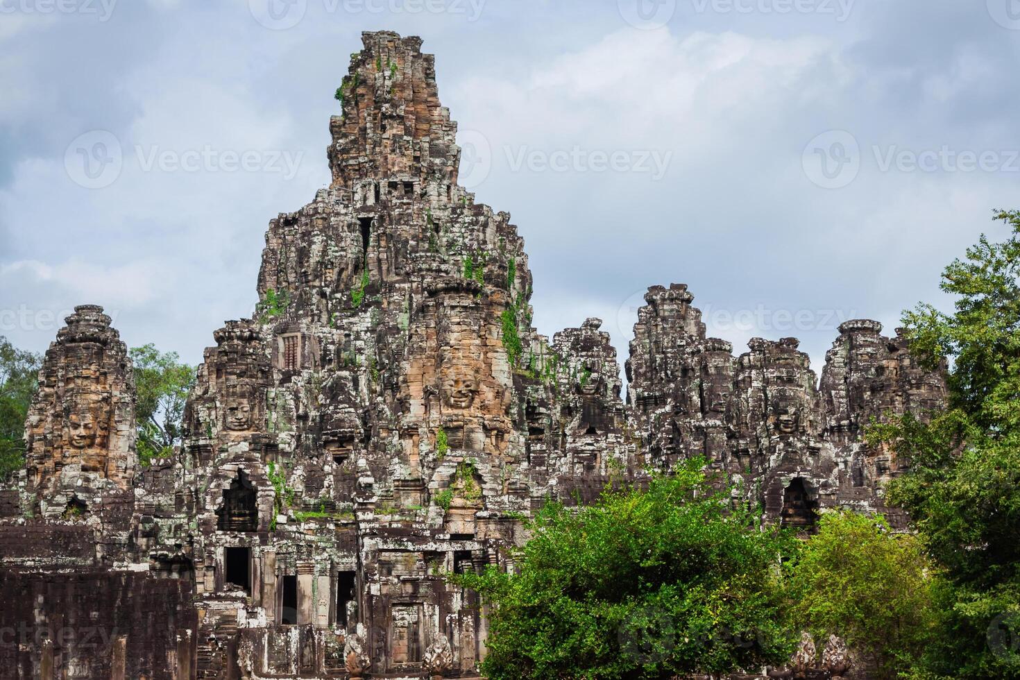 Ancient stone faces of Bayon temple, Angkor, Cambodia photo