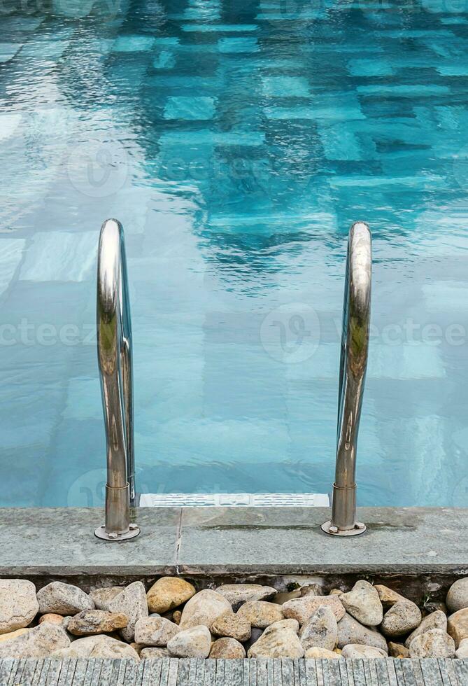 Stairs with handrail, entrance to the swimming pool. photo