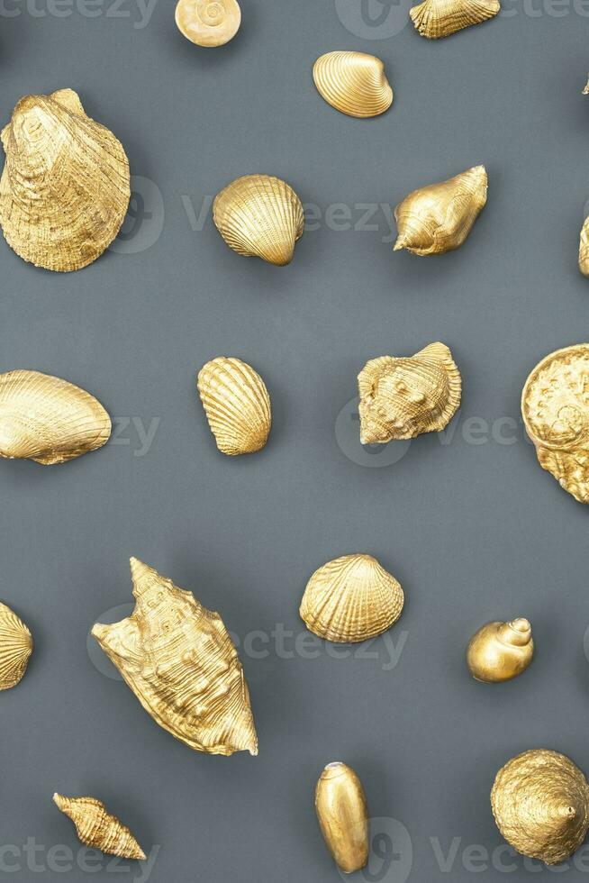 Gold sea shells arrangement. photo