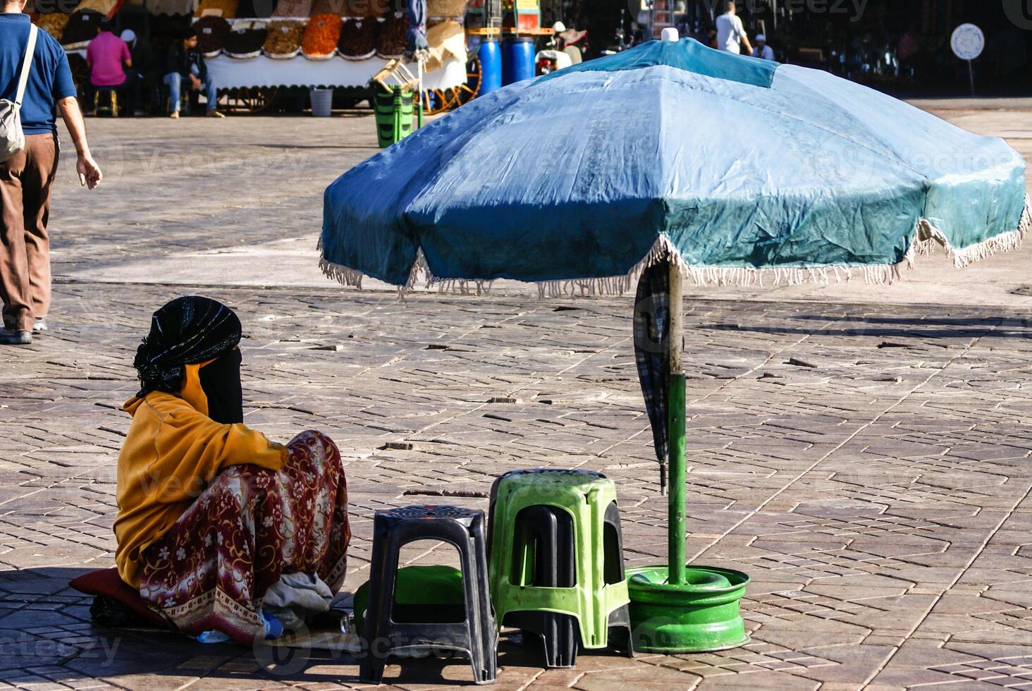 Unidentified woman at a street in Marrakesh photo