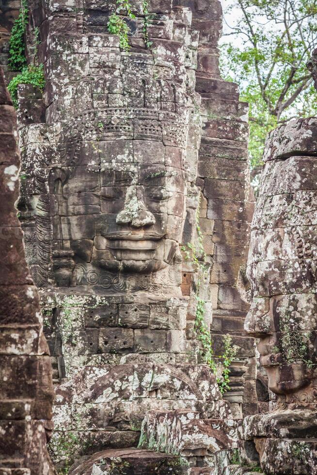 Faces of ancient Bayon Temple At Angkor Wat, Siem Reap, Cambodia photo