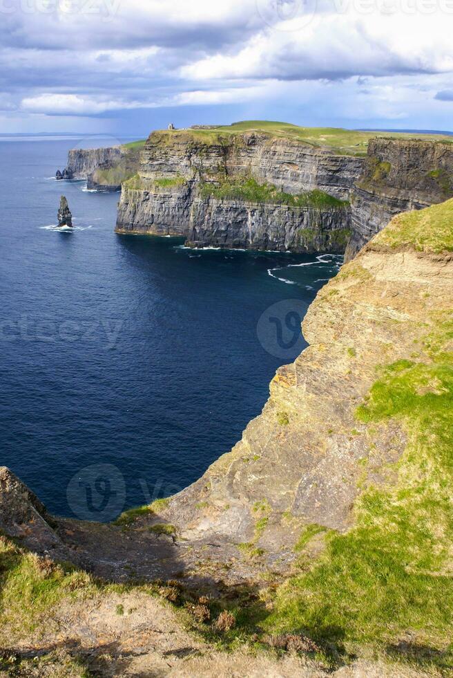 Famous cliffs of Moher with tower. Ireland photo